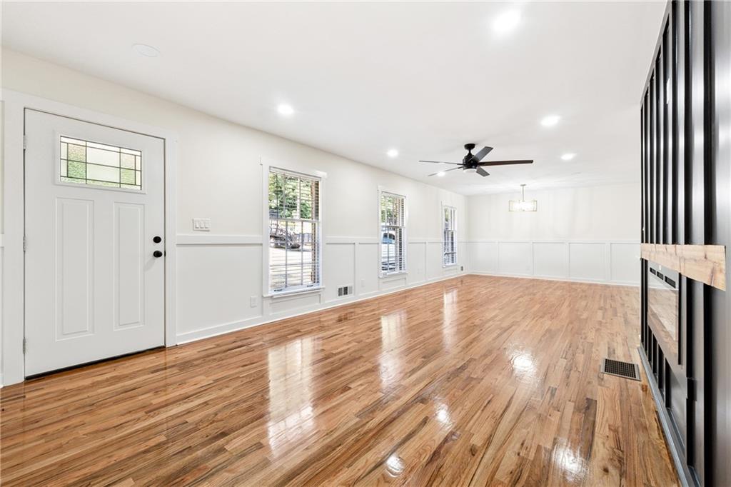 2055 Oak Road Southwest Snellville, GA 30078 - Photo 5 of 33 a view of empty room with wooden floor and fan