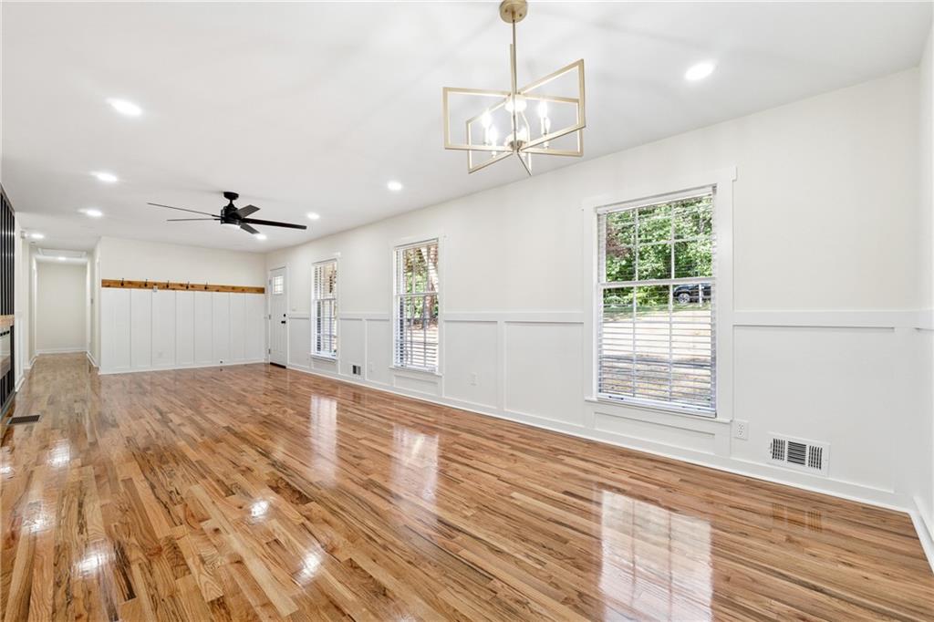 2055 Oak Road Southwest Snellville, GA 30078 - Photo 9 of 33 a view of an empty room with wooden floor and a window