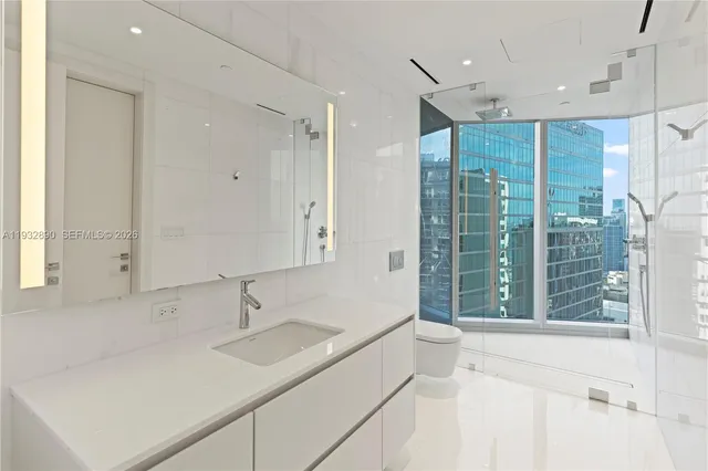 a bathroom with a sink and a large mirror