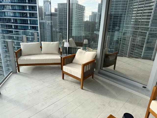 a view of terrace with seating space and stairs