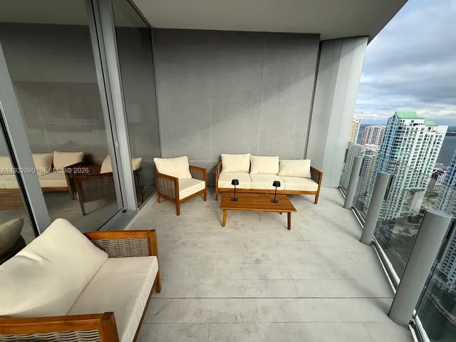 a living room with furniture and a rug