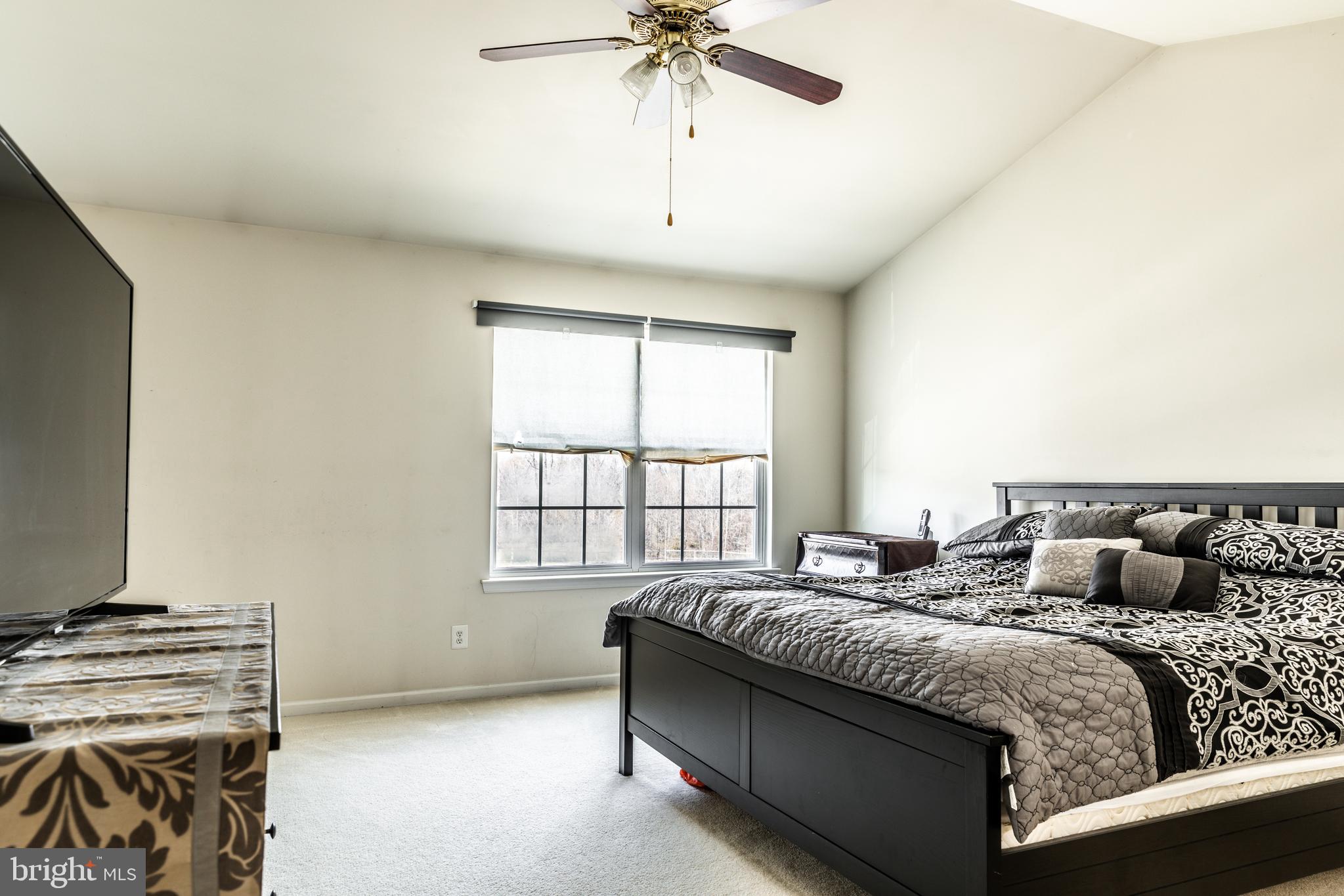108 Eagleview Terrace Mount Royal, NJ 08061 - Photo 15 of 24 a bedroom with a bed and a chandelier