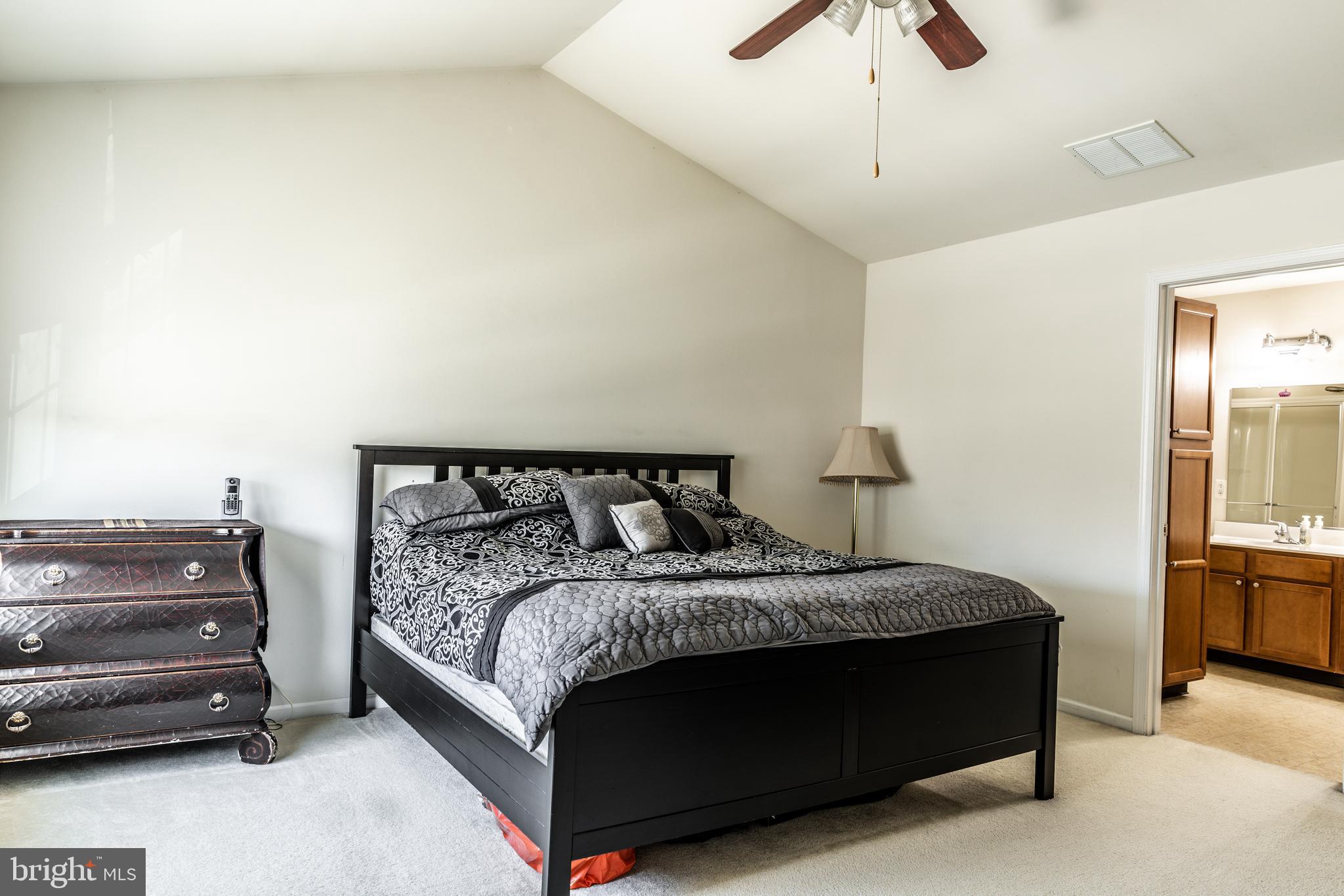 108 Eagleview Terrace Mount Royal, NJ 08061 - Photo 18 of 24 a bedroom with a bed and a chandelier