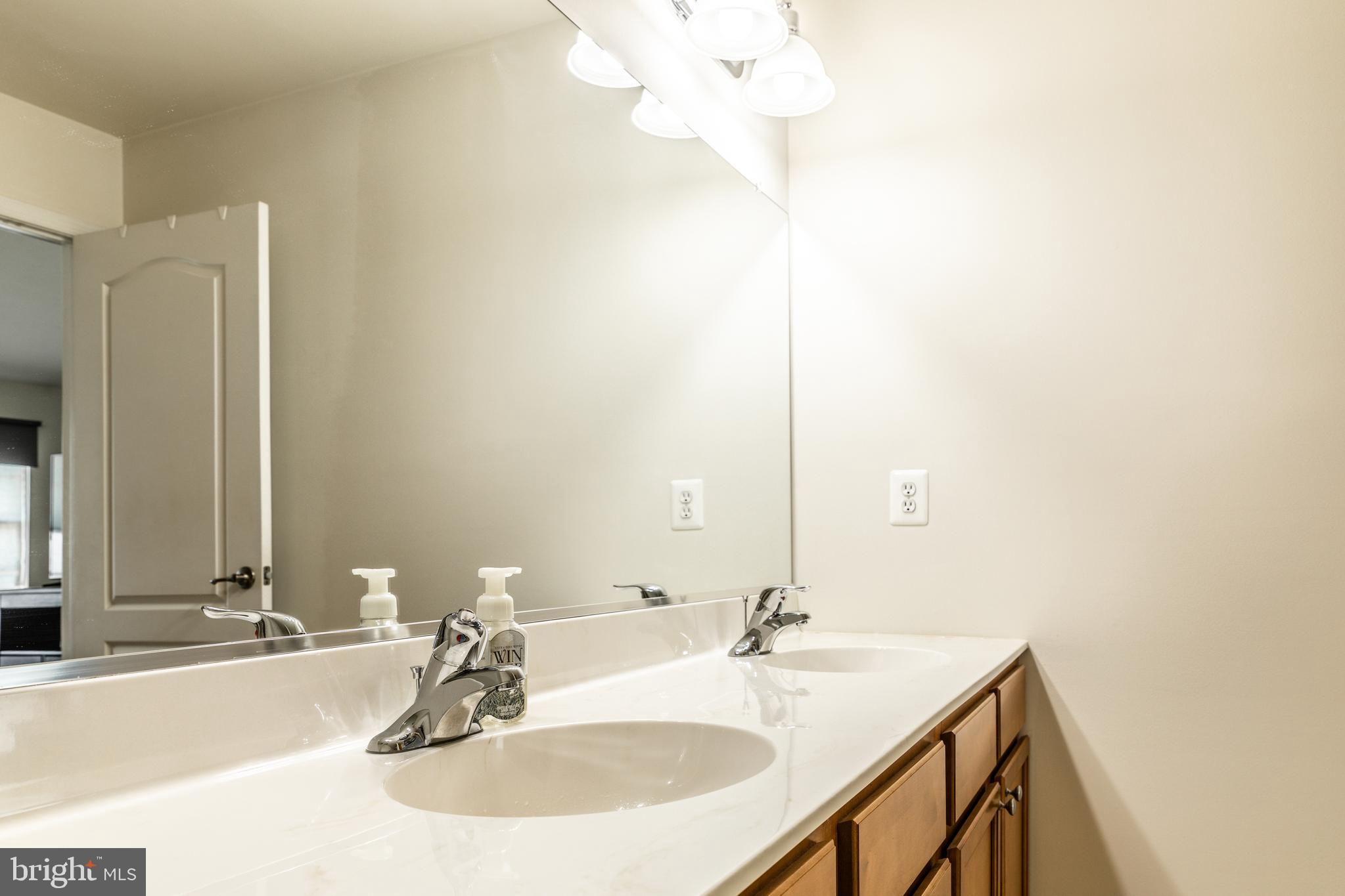 108 Eagleview Terrace Mount Royal, NJ 08061 - Photo 19 of 24 a bathroom with a sink and a mirror