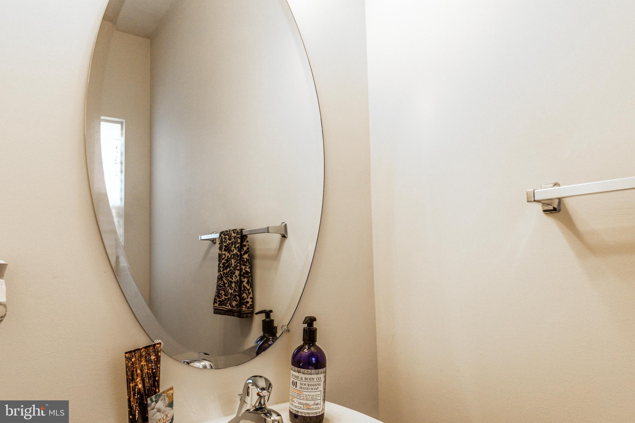 108 Eagleview Terrace Mount Royal, NJ 08061 - Photo 3 of 24 a bathroom with a sink and mirror with toilet