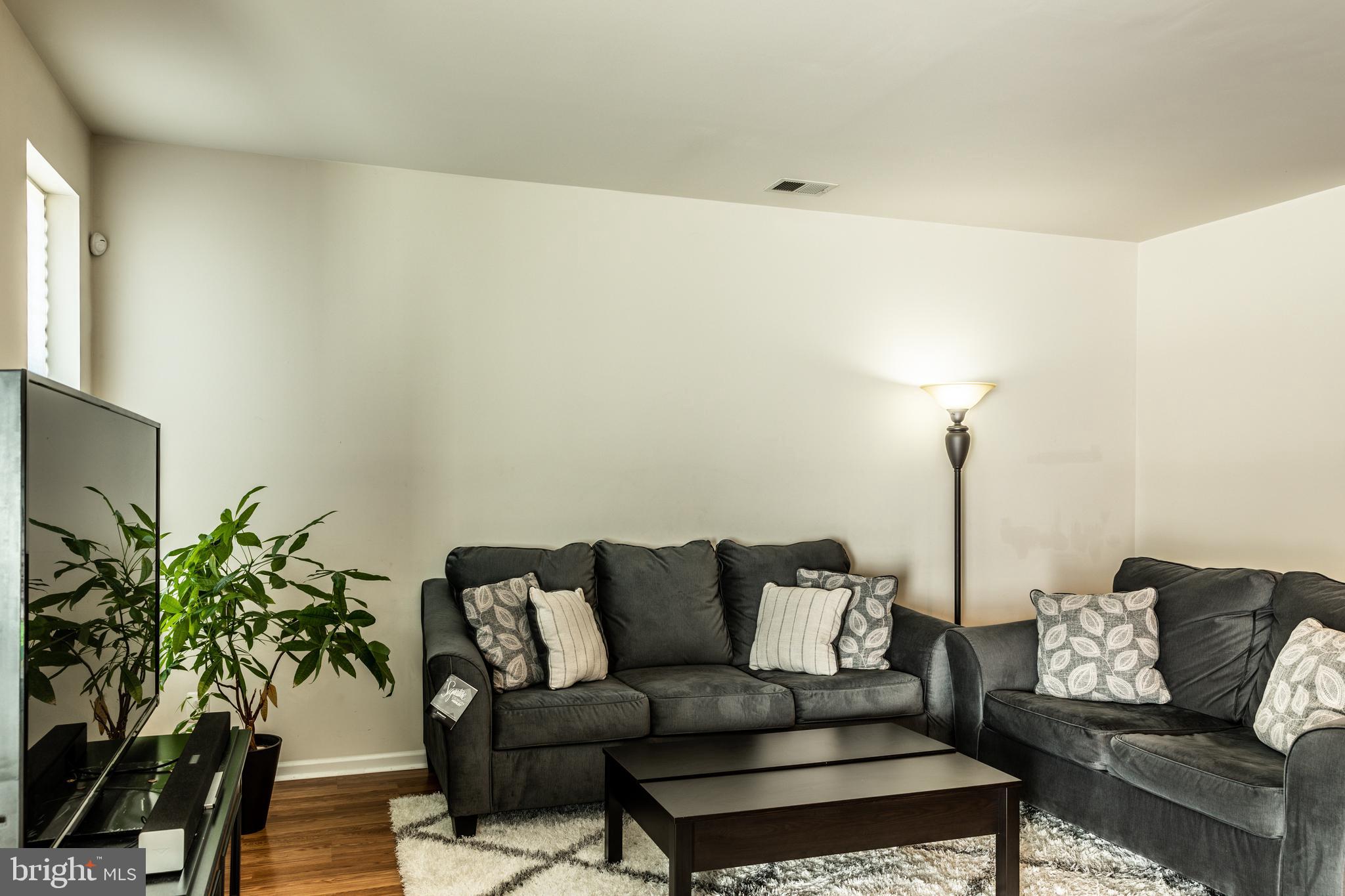 108 Eagleview Terrace Mount Royal, NJ 08061 - Photo 5 of 24 a living room with furniture and a potted plant