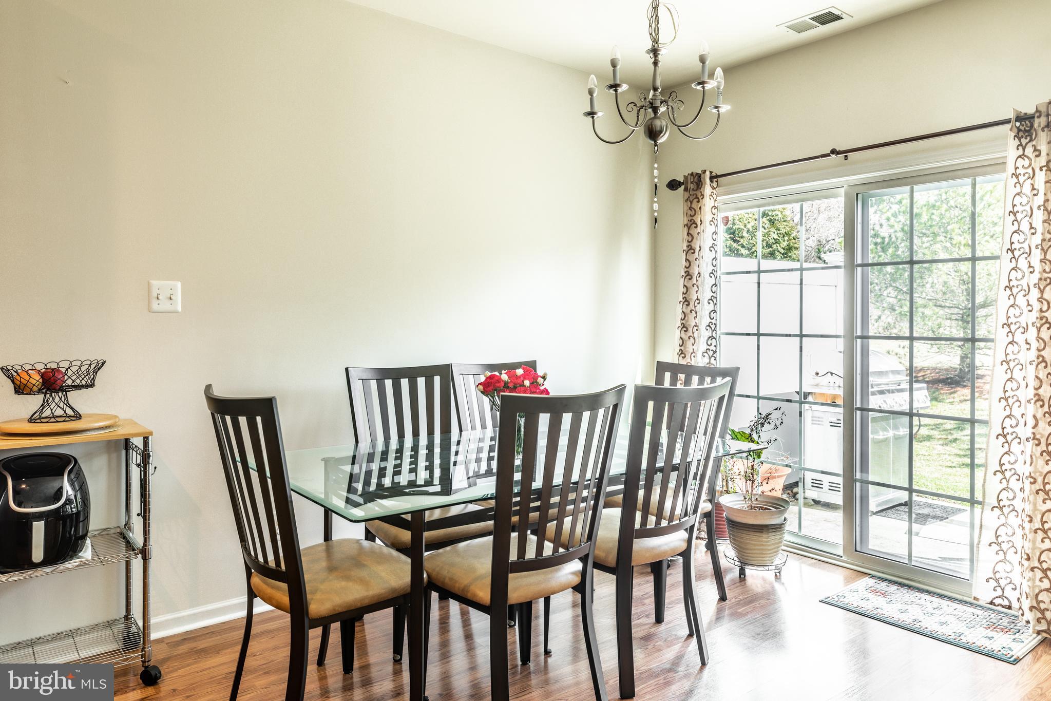 108 Eagleview Terrace Mount Royal, NJ 08061 - Photo 6 of 24 a view of a dining room with furniture wooden floor and chandelier