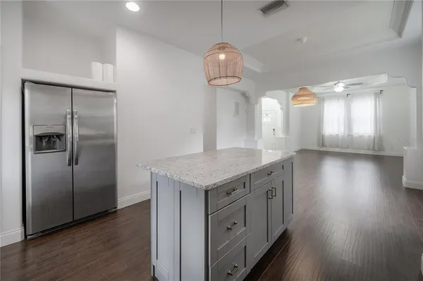 an empty room with wooden floor