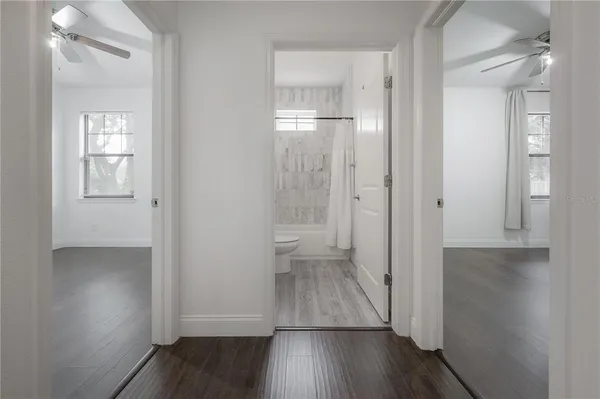 wooden floor with white walls