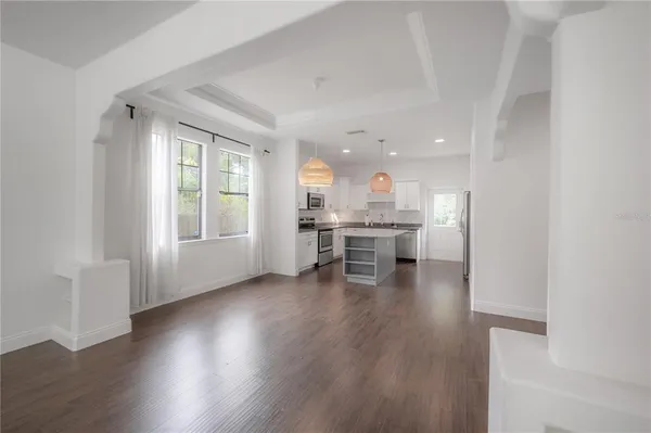 a view of kitchen with wooden floor and outdoor space