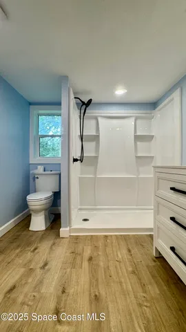 a view of room with flat screen tv