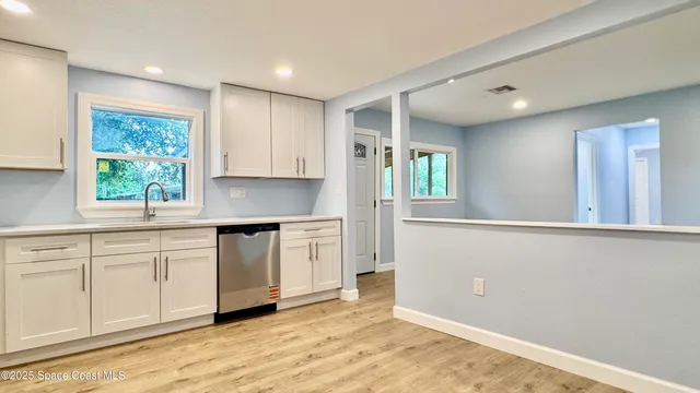 a view of livingroom with furniture and workspace