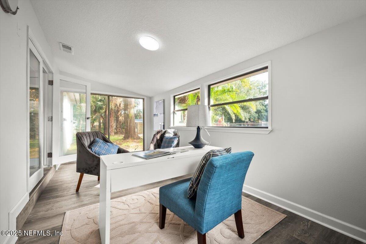 2905 Sandhurst Road East Jacksonville, FL 32277 - Photo 11 of 28 a living room with furniture and a window