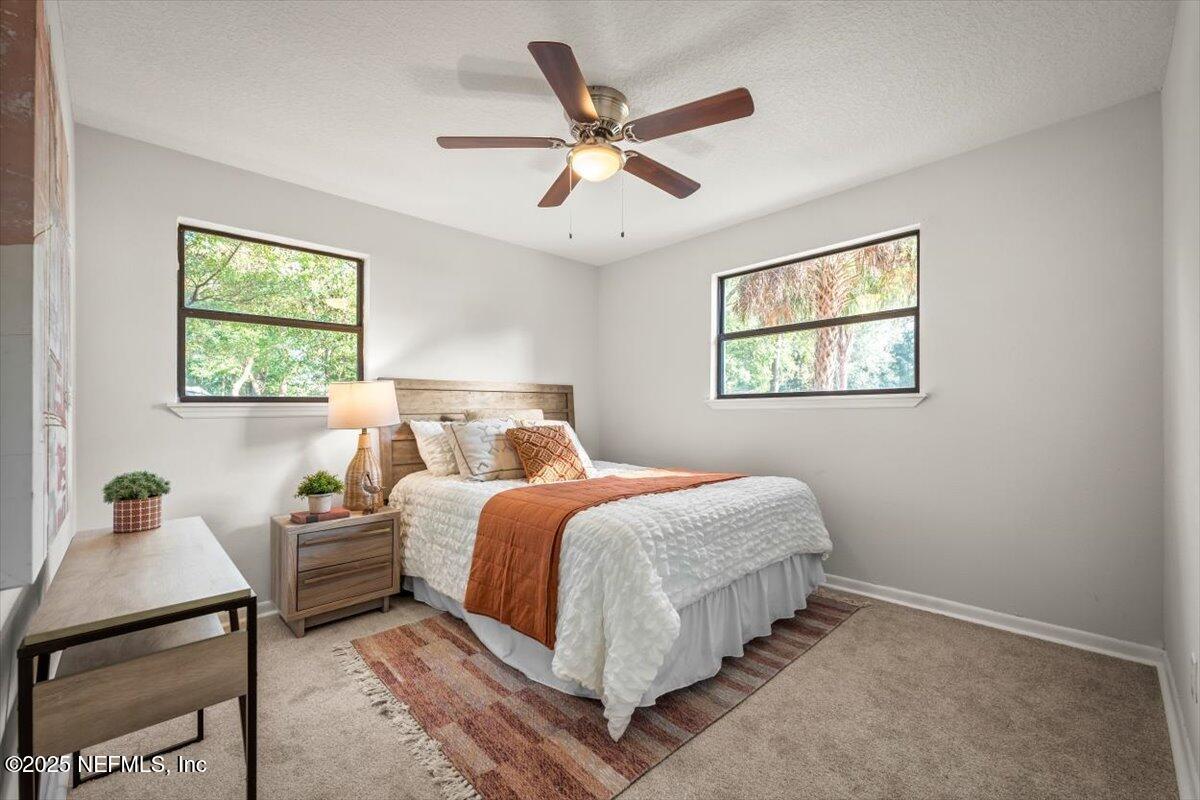 2905 Sandhurst Road East Jacksonville, FL 32277 - Photo 22 of 28 a bedroom with bed and window