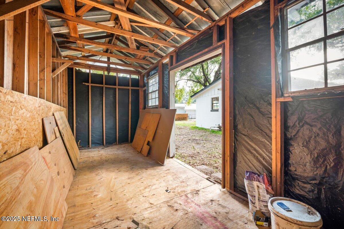 2905 Sandhurst Road East Jacksonville, FL 32277 - Photo 28 of 28 a view of a porch with a table and chairs