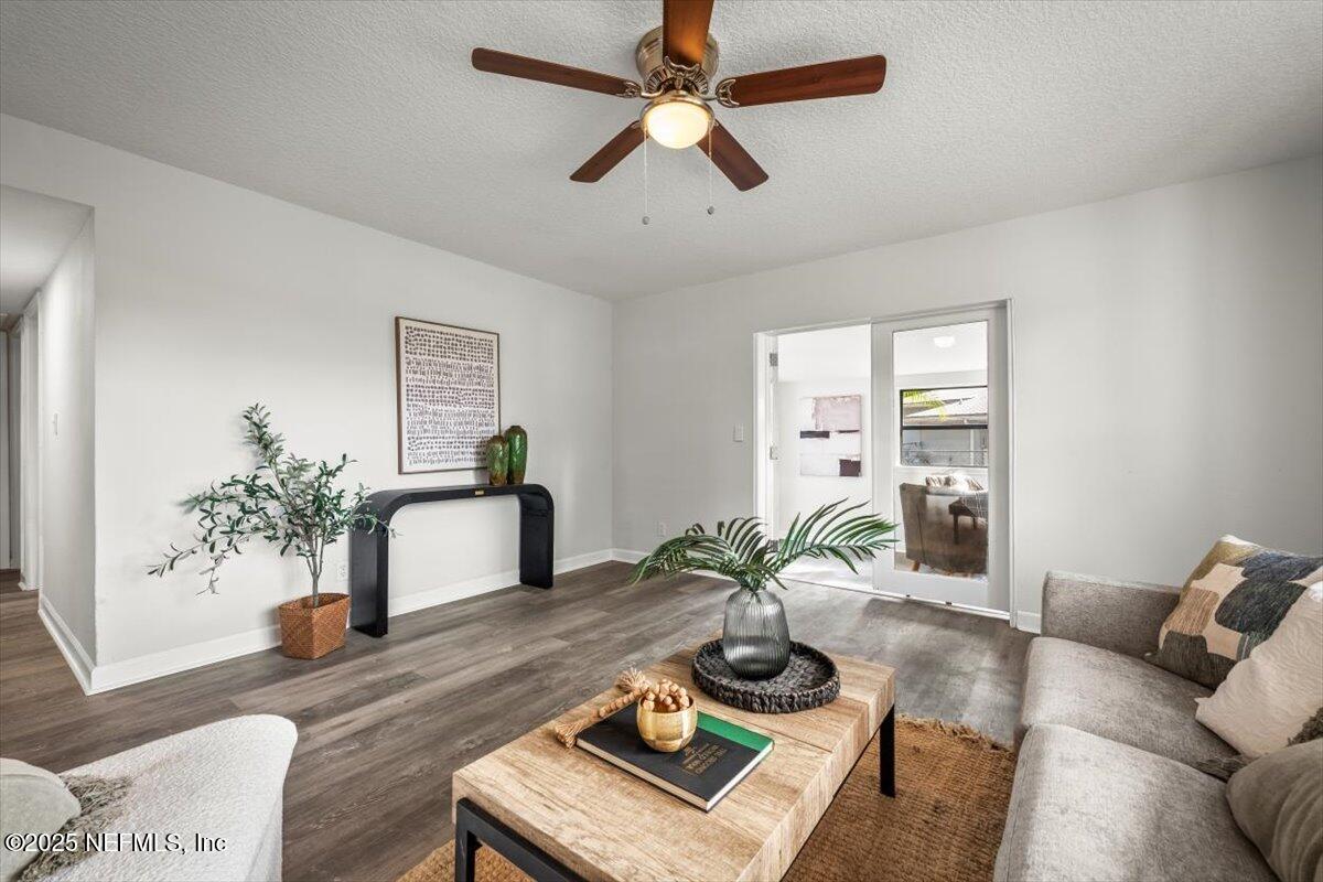 2905 Sandhurst Road East Jacksonville, FL 32277 - Photo 9 of 28 a living room with furniture and a potted plant