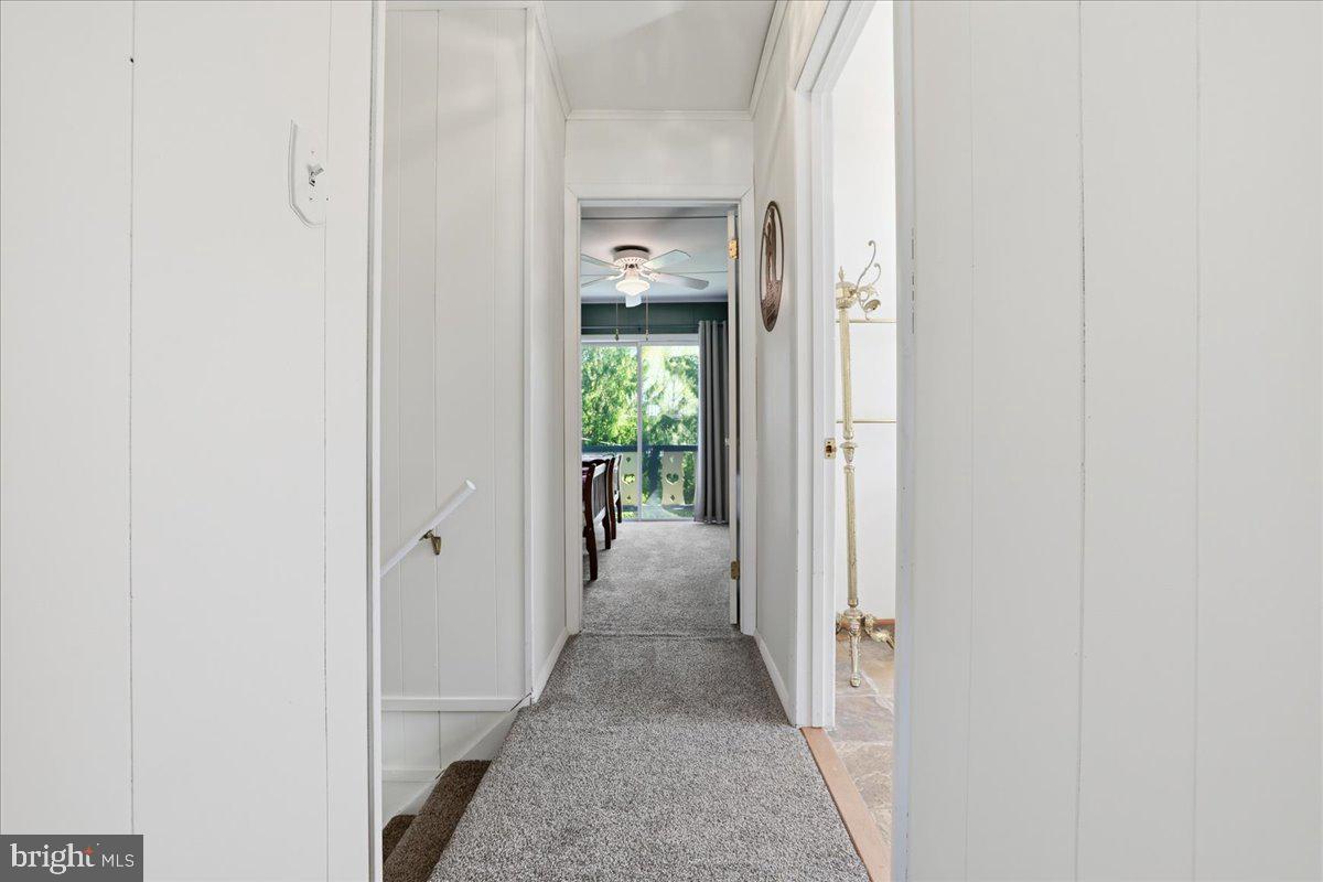 25 Fall Place Union Dale, PA 18470 - Photo 16 of 99 a view of a hallway with wooden floor and a bathroom