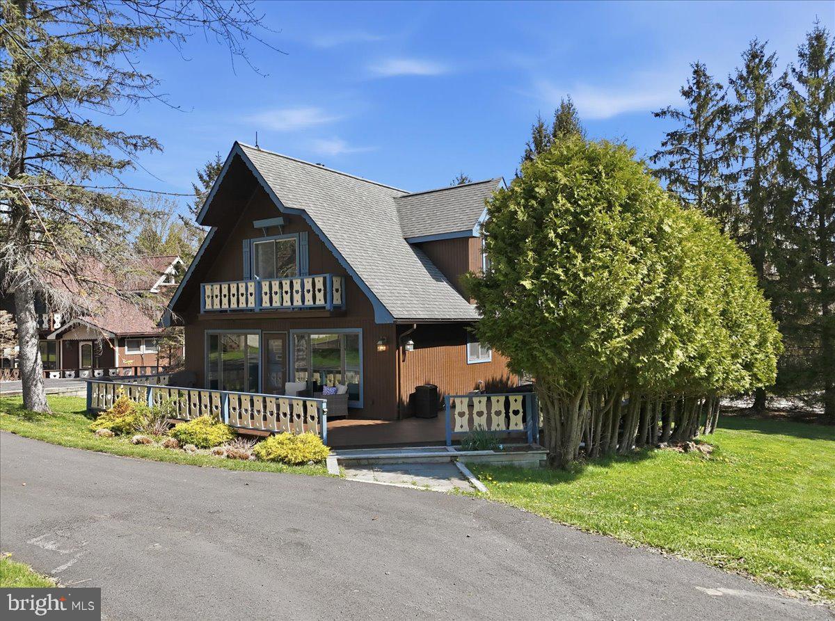 25 Fall Place Union Dale, PA 18470 - Photo 3 of 99 Charming chalet with lush greenery.