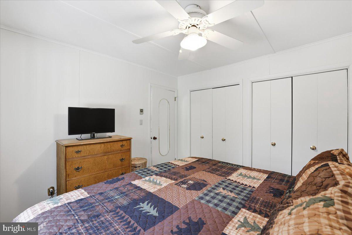 25 Fall Place Union Dale, PA 18470 - Photo 35 of 99 a bedroom with a bed and a flat screen tv