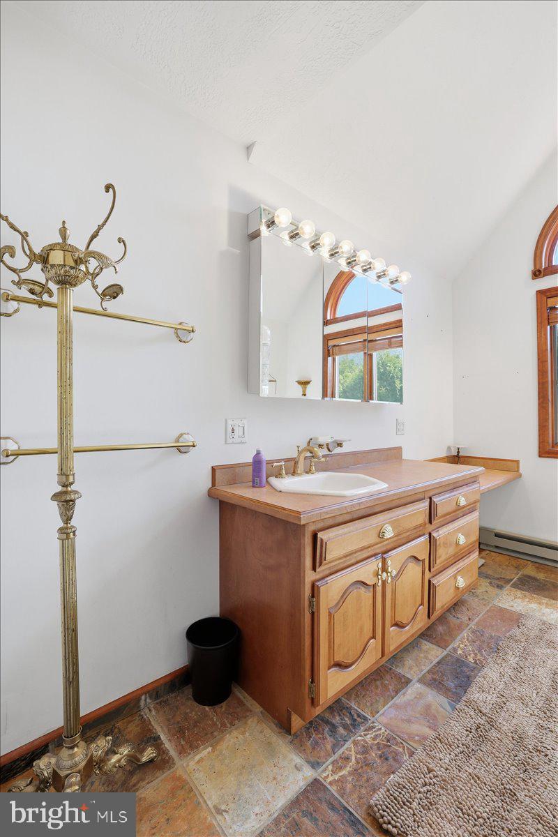 25 Fall Place Union Dale, PA 18470 - Photo 39 of 99 a bathroom with a sink and a mirror