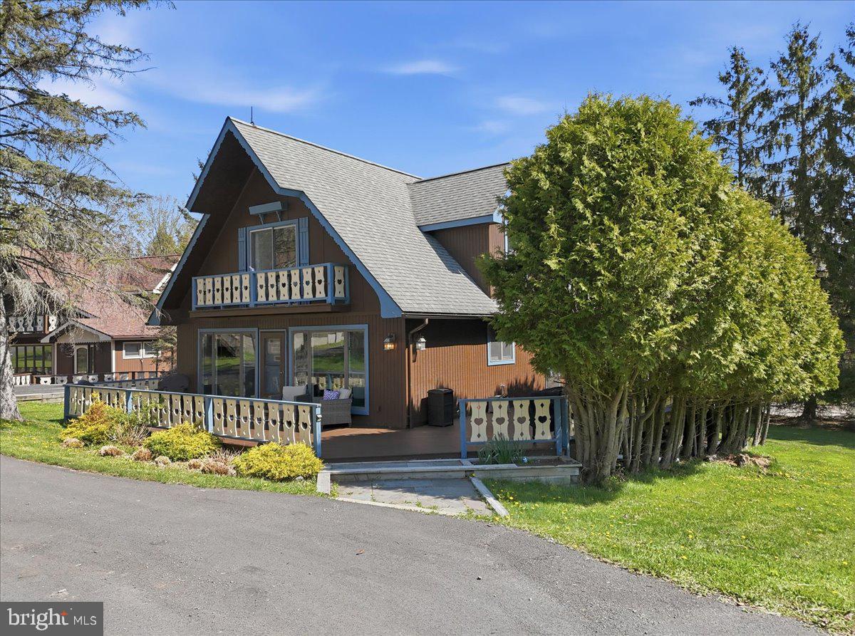 25 Fall Place Union Dale, PA 18470 - Photo 6 of 99 Charming chalet with lush greenery.