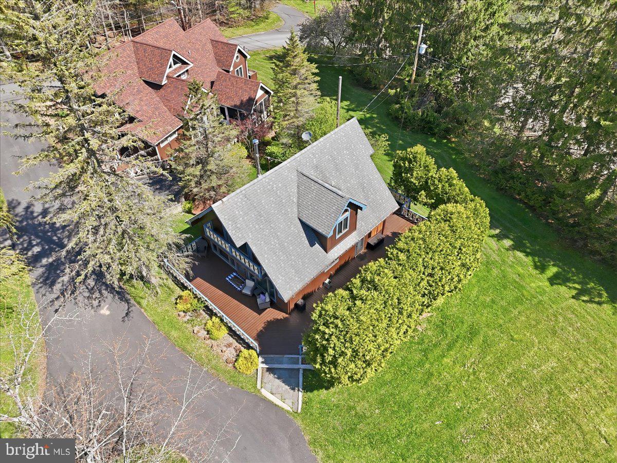 25 Fall Place Union Dale, PA 18470 - Photo 74 of 99 an aerial view of a house with a yard and trees