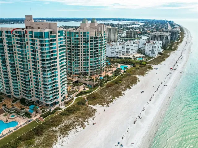 a view of a swimming pool with a table and chairs