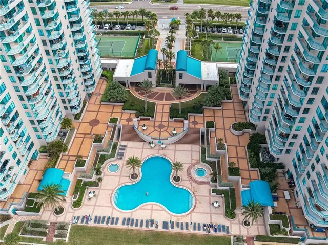 a view of a kitchen with a sink and a refrigerator