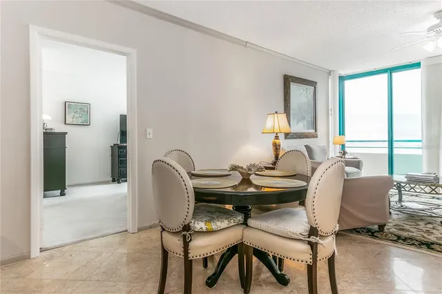 a bedroom with a bed and a dresser next to a window