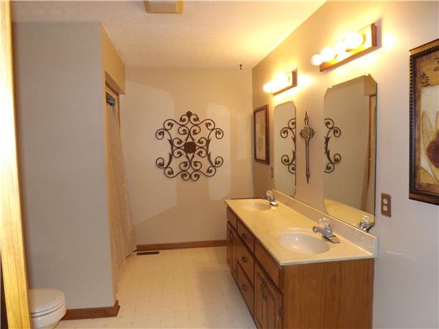 173 Urban Farms Road Manchester, TN 37355 - Photo 17 of 20 a bathroom with a sink mirror and a toilet