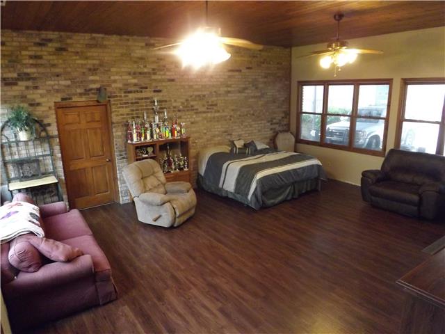 173 Urban Farms Road Manchester, TN 37355 - Photo 19 of 20 a spacious bedroom with two beds and a couch