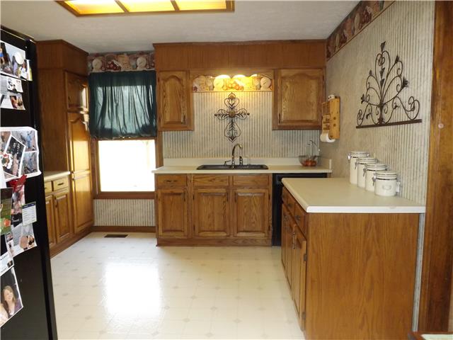 173 Urban Farms Road Manchester, TN 37355 - Photo 9 of 20 a kitchen with a sink stove and cabinets