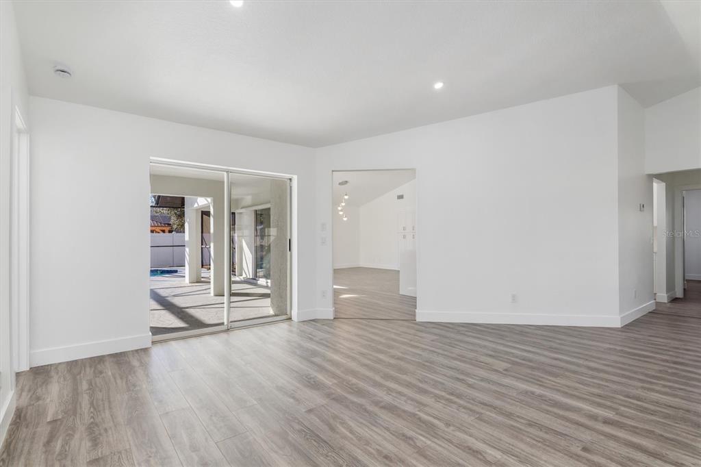 375 Waterside Street Port Charlotte, FL 33954 - Photo 12 of 49 a view of empty room with wooden floor