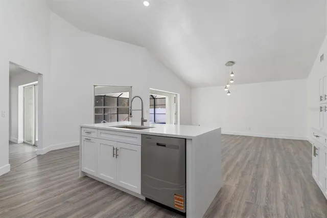 a view with cabinets wooden floor and a window
