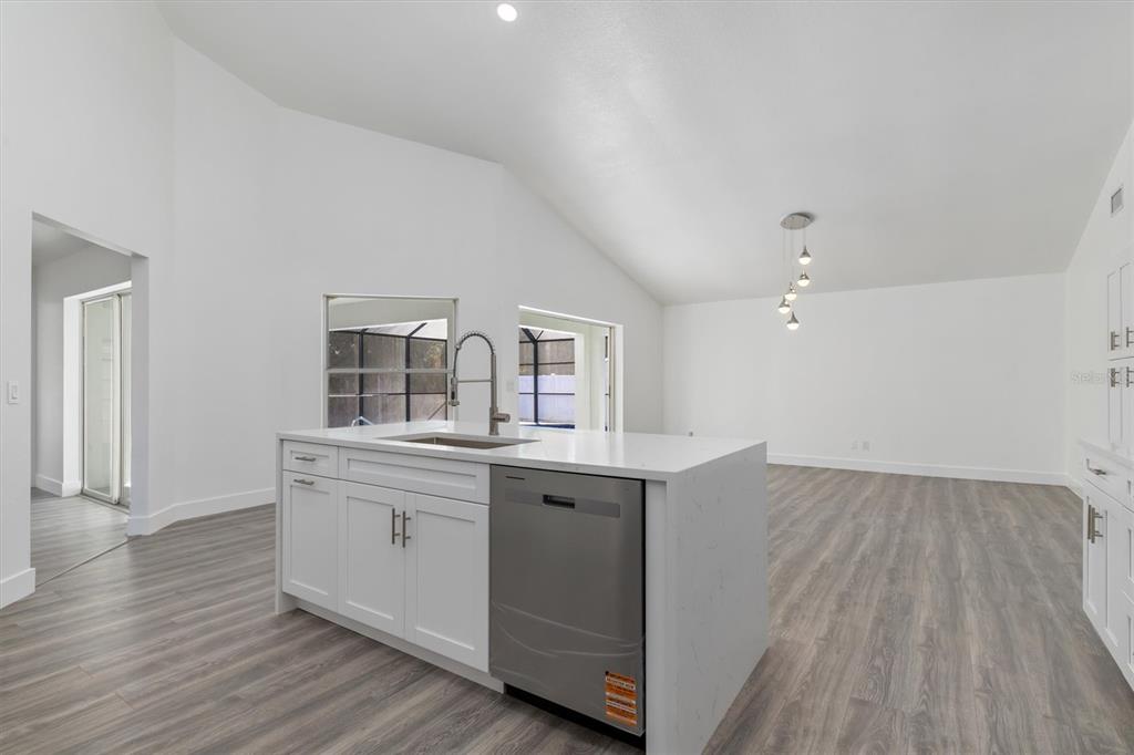 375 Waterside Street Port Charlotte, FL 33954 - Photo 19 of 49 a view with cabinets wooden floor and a window