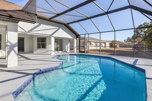 a view of a swimming pool with a patio