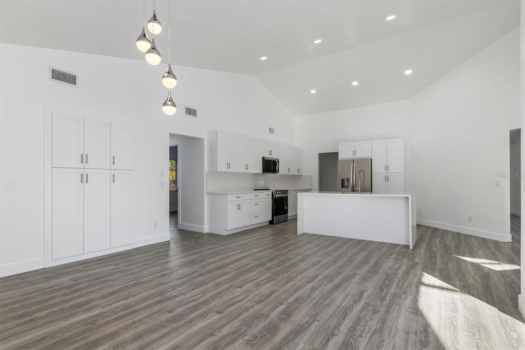 375 Waterside Street Port Charlotte, FL 33954 - Photo 21 of 49 a view of a kitchen with microwave and cabinets