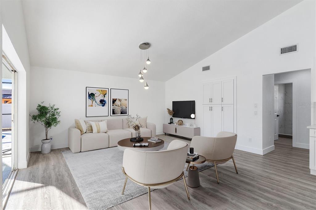 375 Waterside Street Port Charlotte, FL 33954 - Photo 22 of 49 a living room with furniture a rug and a flat screen tv