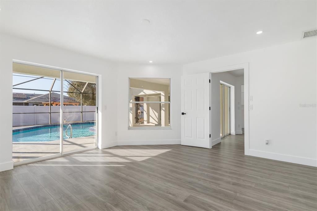 375 Waterside Street Port Charlotte, FL 33954 - Photo 29 of 49 an empty room with wooden floor and window