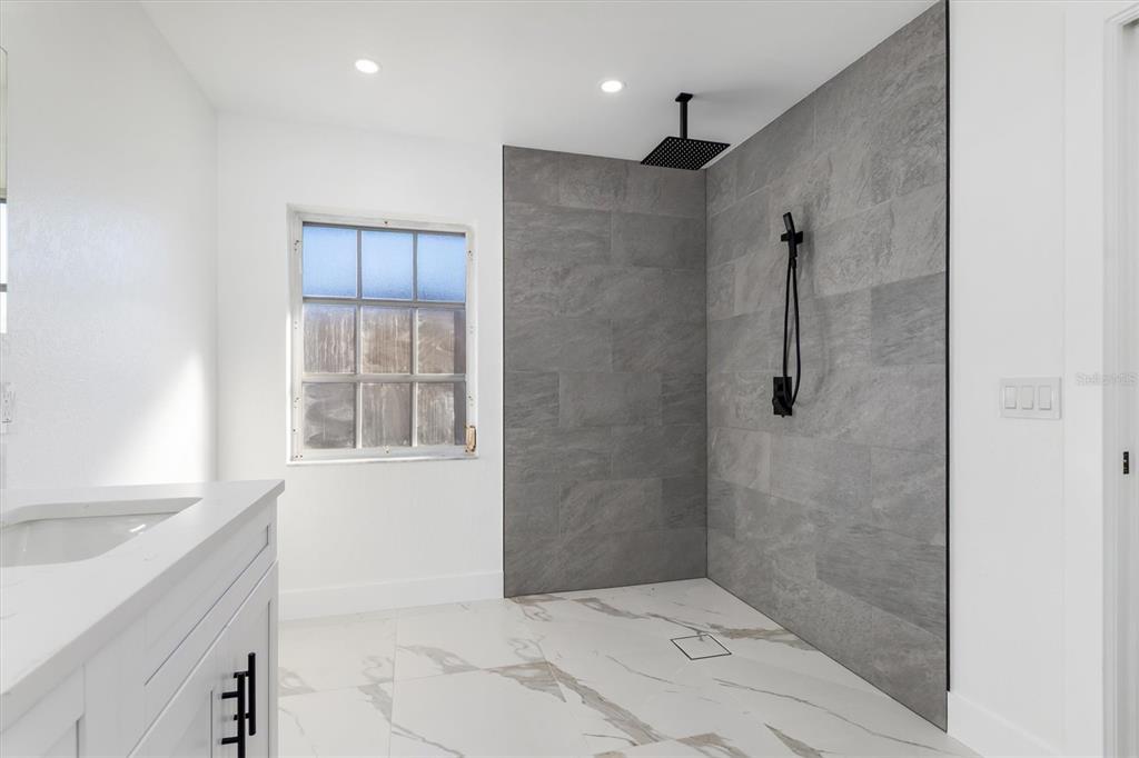 375 Waterside Street Port Charlotte, FL 33954 - Photo 31 of 49 a bathroom with a shower and a sink