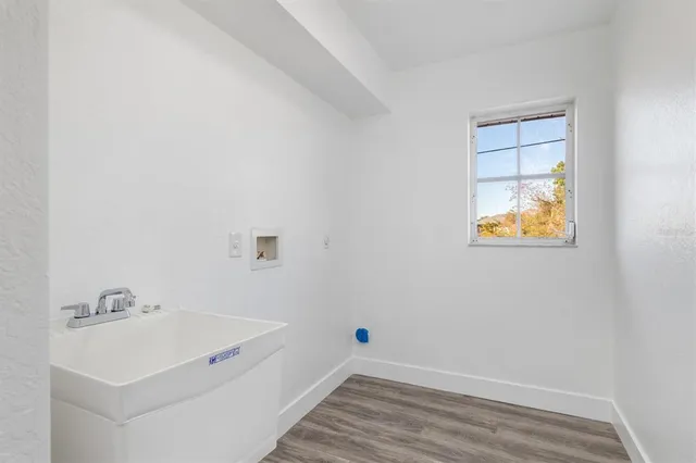 a bathroom with a sink and a window