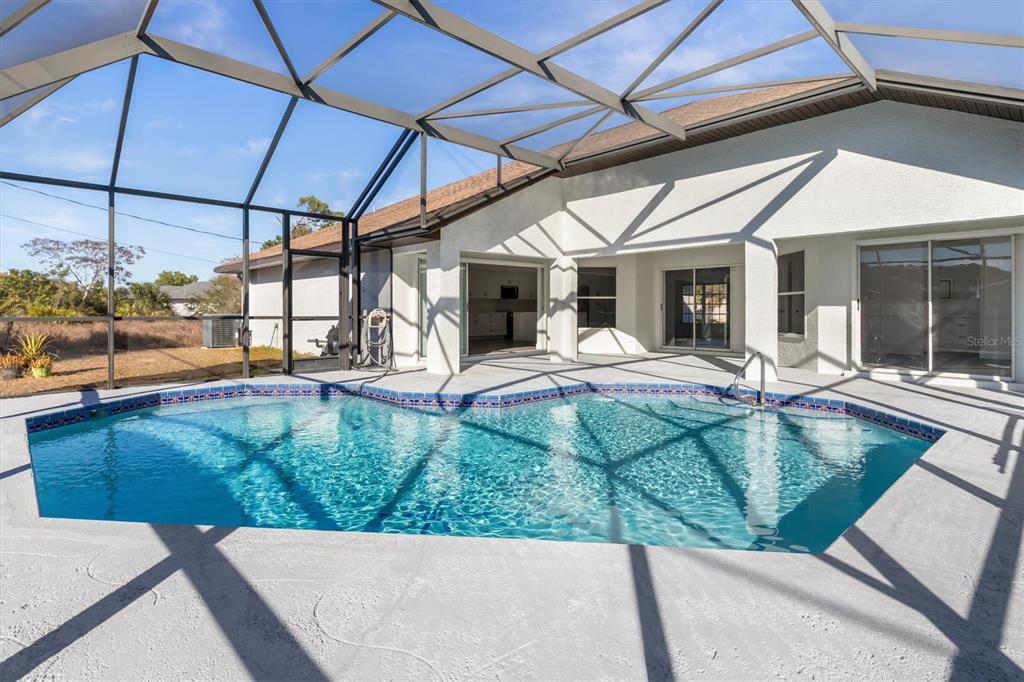 375 Waterside Street Port Charlotte, FL 33954 - Photo 40 of 49 a view of a house with backyard porch and sitting area