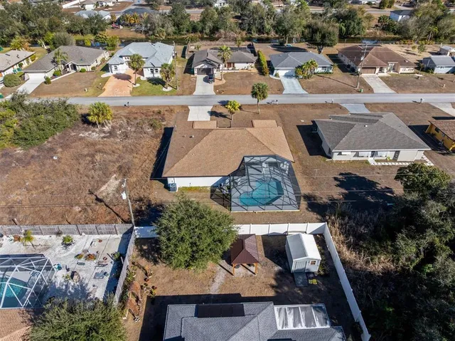 an aerial view of residential houses with outdoor space