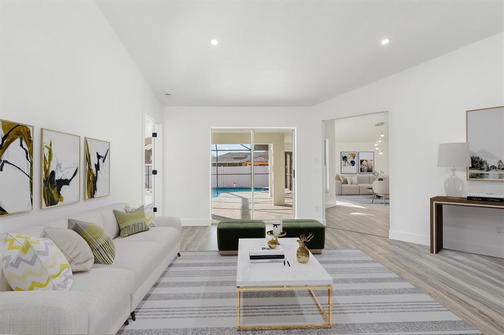 375 Waterside Street Port Charlotte, FL 33954 - Photo 9 of 49 a living room with furniture and wooden floor