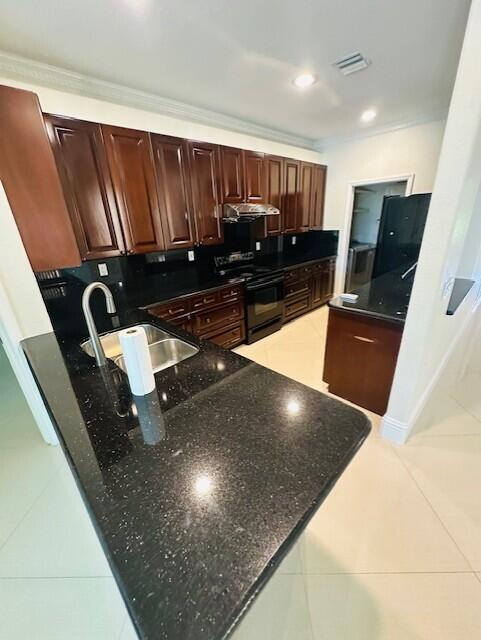 5245 Sancerre Circle Lake Worth, FL 33463 - Photo 12 of 46 a view of kitchen with a sink and wooden floor