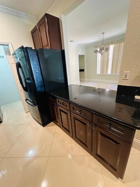 5245 Sancerre Circle Lake Worth, FL 33463 - Photo 13 of 46 a kitchen with granite countertop a refrigerator and stove