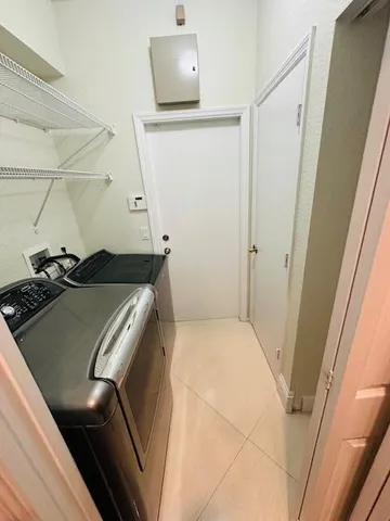 a view of kitchen with furniture and a ceiling fan
