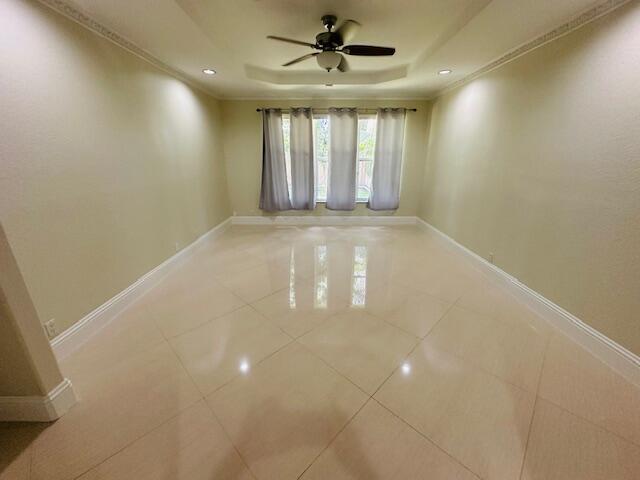 5245 Sancerre Circle Lake Worth, FL 33463 - Photo 17 of 46 a view of an empty room with a window