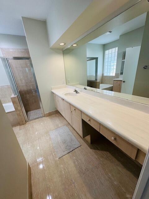 5245 Sancerre Circle Lake Worth, FL 33463 - Photo 20 of 46 a large bathroom with a double vanity sink and a mirror
