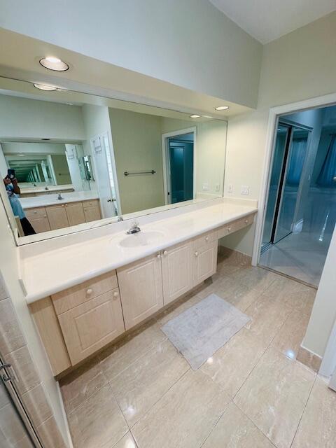 5245 Sancerre Circle Lake Worth, FL 33463 - Photo 23 of 46 a bathroom with a sink and a mirror